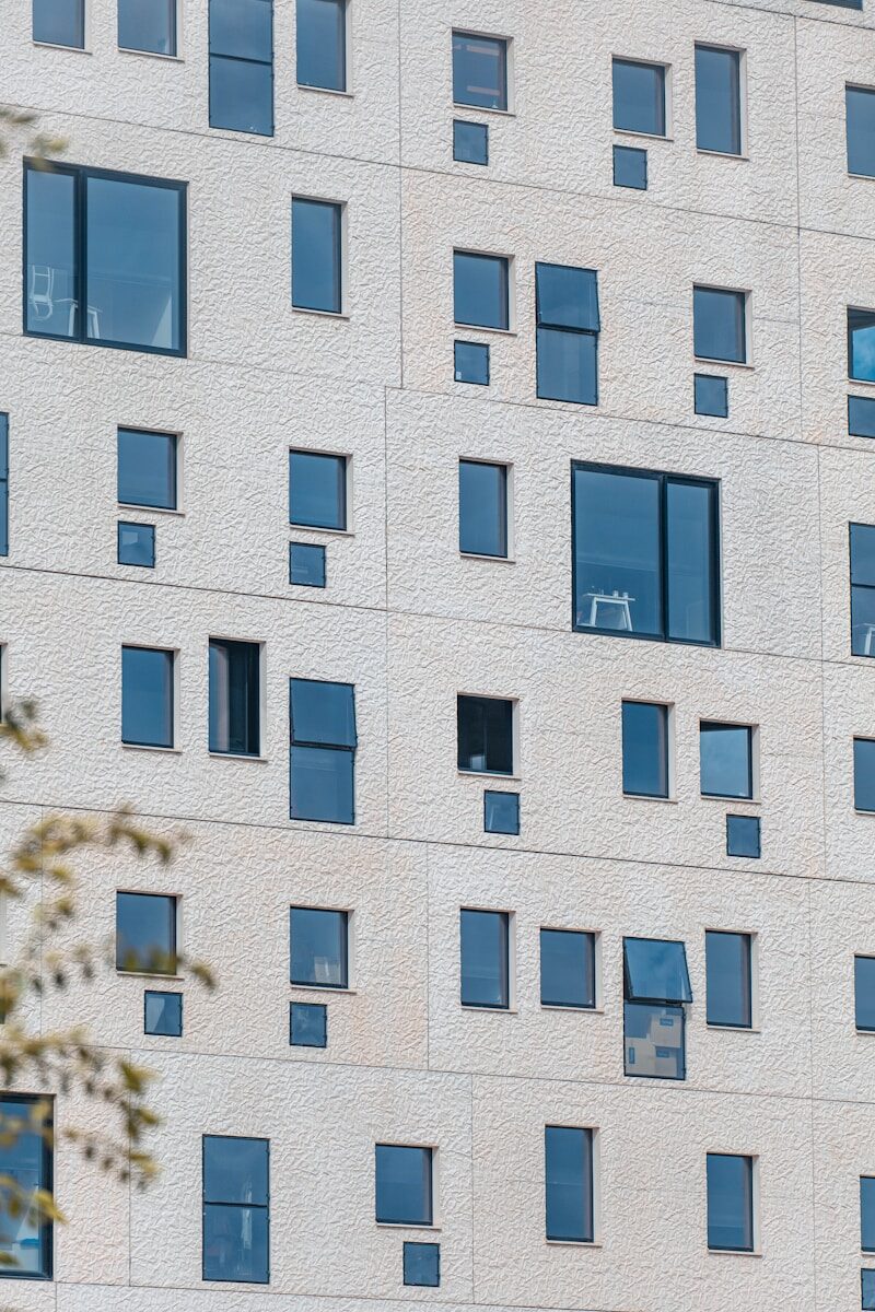 A tall white building with lots of windows