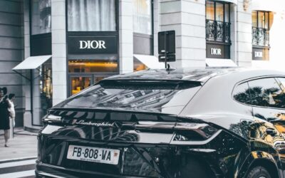 black car photo across Dior store