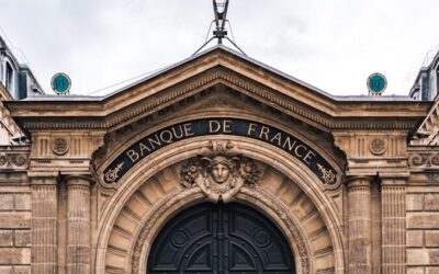 a large stone statue in front of a building
