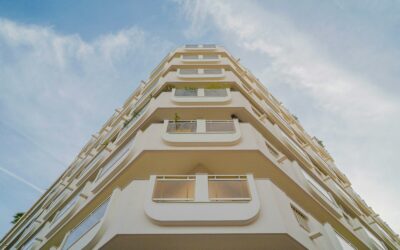 Modern apartment building viewed from below against sky