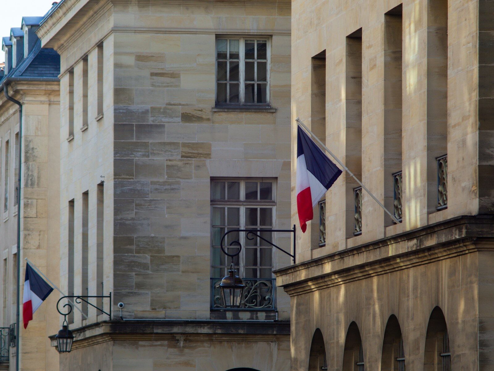 a building with two flags flying in front of it