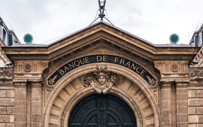 a large stone statue in front of a building