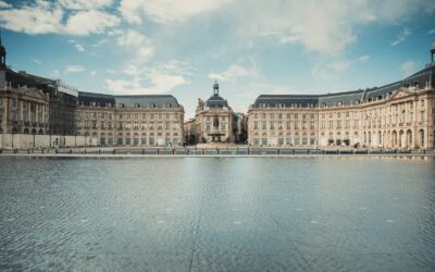 a large building with a large body of water in front of it